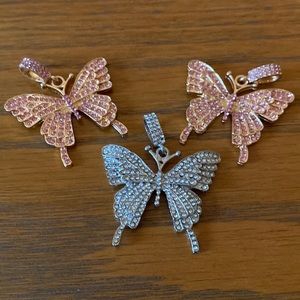 Rhinestone butterfly pendent. I have the 2 rose gold tone and one silver tone.